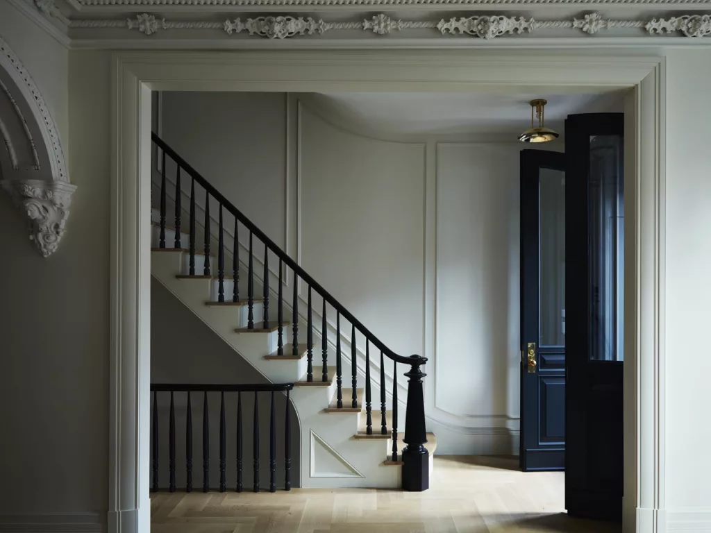 The transformation of a brownstone staircase, where modern comfort meets historical grandeur.