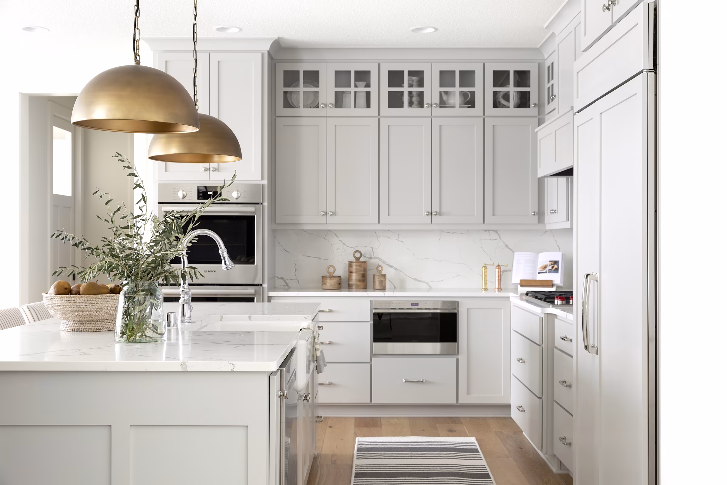 An interior dance of textures, where wood, metal, and glass converge in aesthetic harmony.
