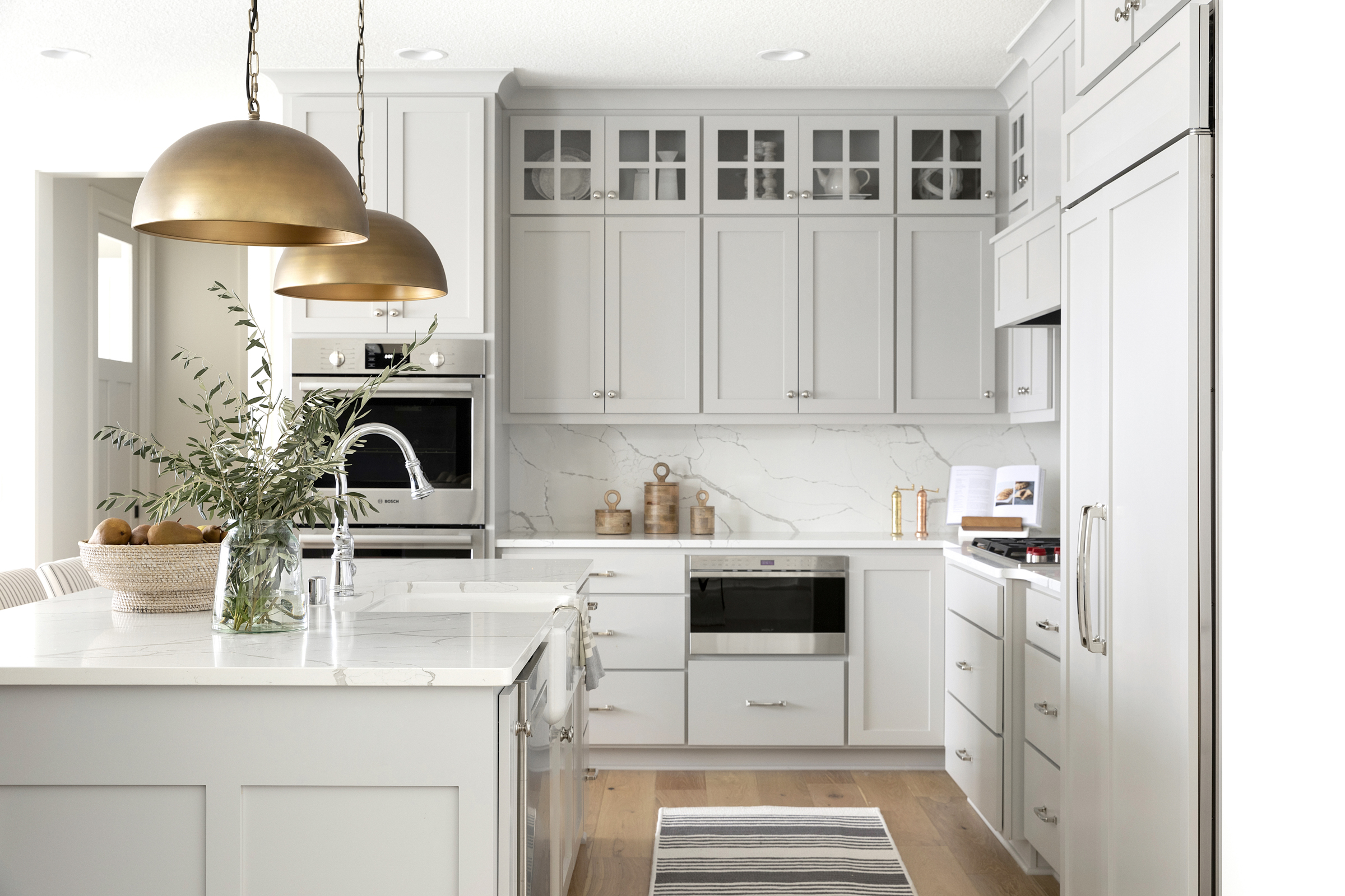 An interior dance of textures, where wood, metal, and glass converge in aesthetic harmony.