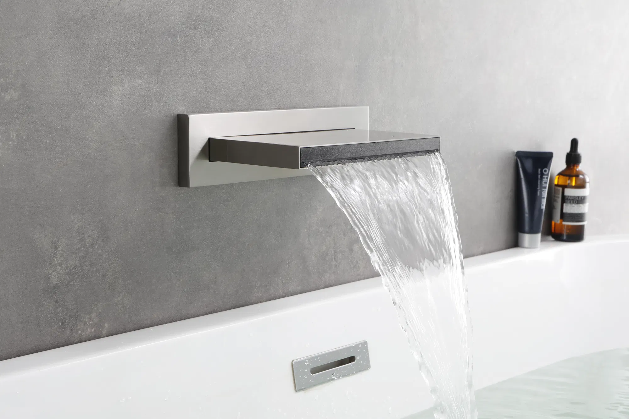 A cascading spout design exuding sheer elegance in a modern bathroom.