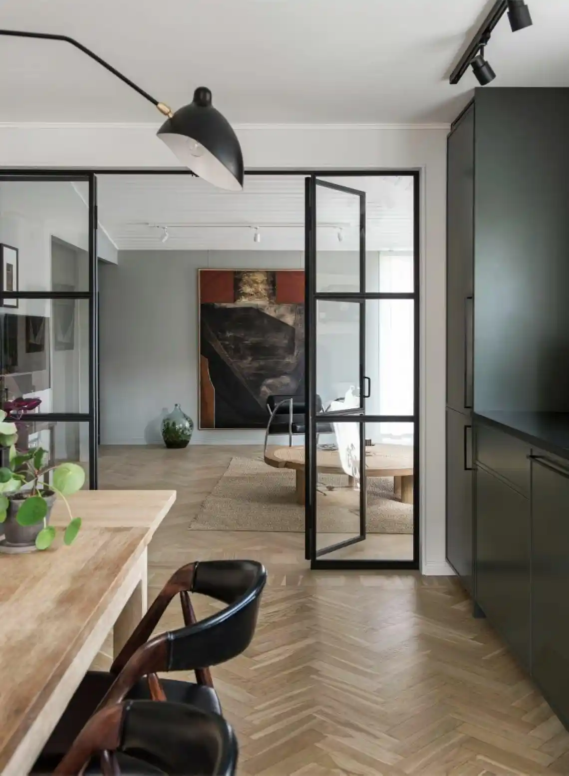 Metal and glass accents create visual interest in luxury millwork.‍