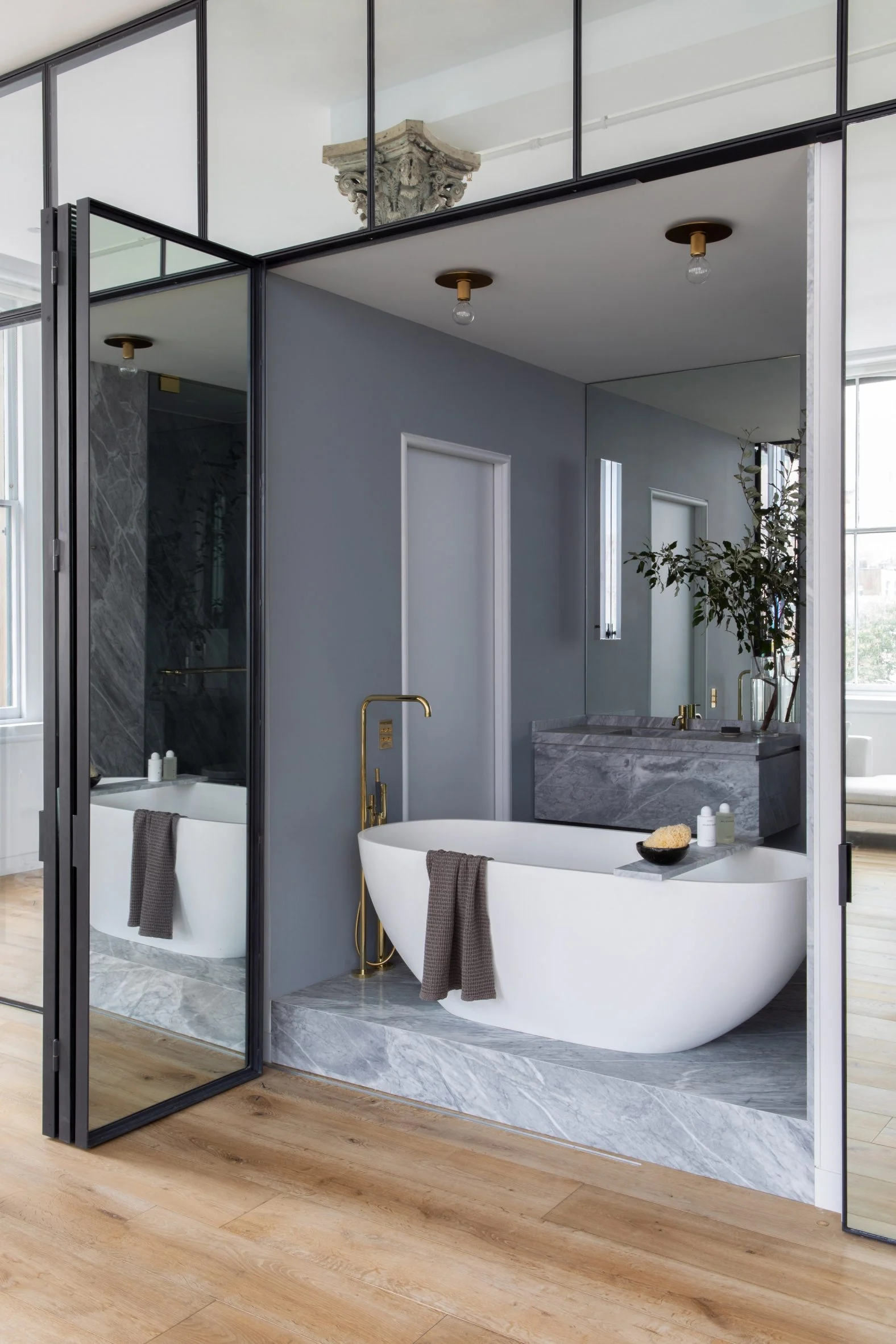 Serene Soaking: The Freestanding Bathtub in the Tribeca Loft Bathroom