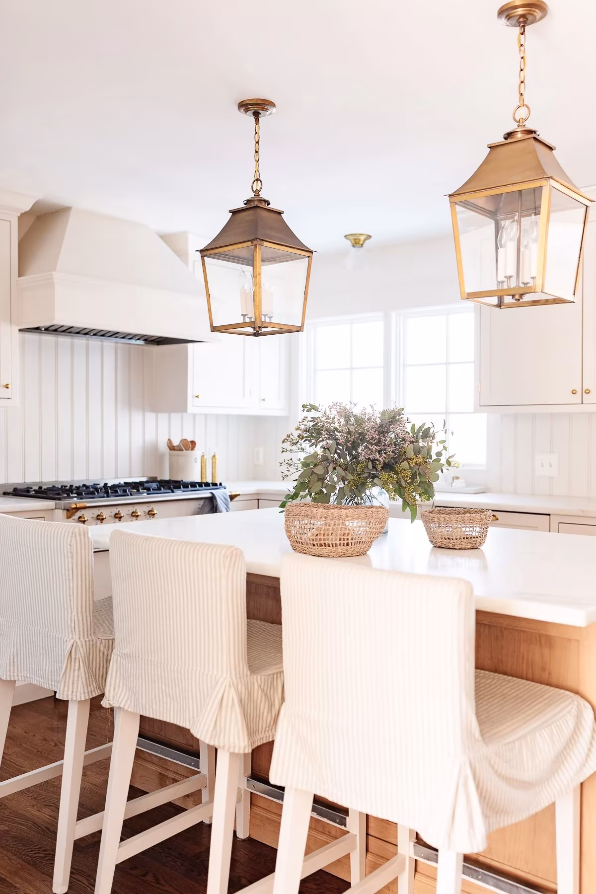 Stylish bar stools adding a touch of elegance to the kitchen island.