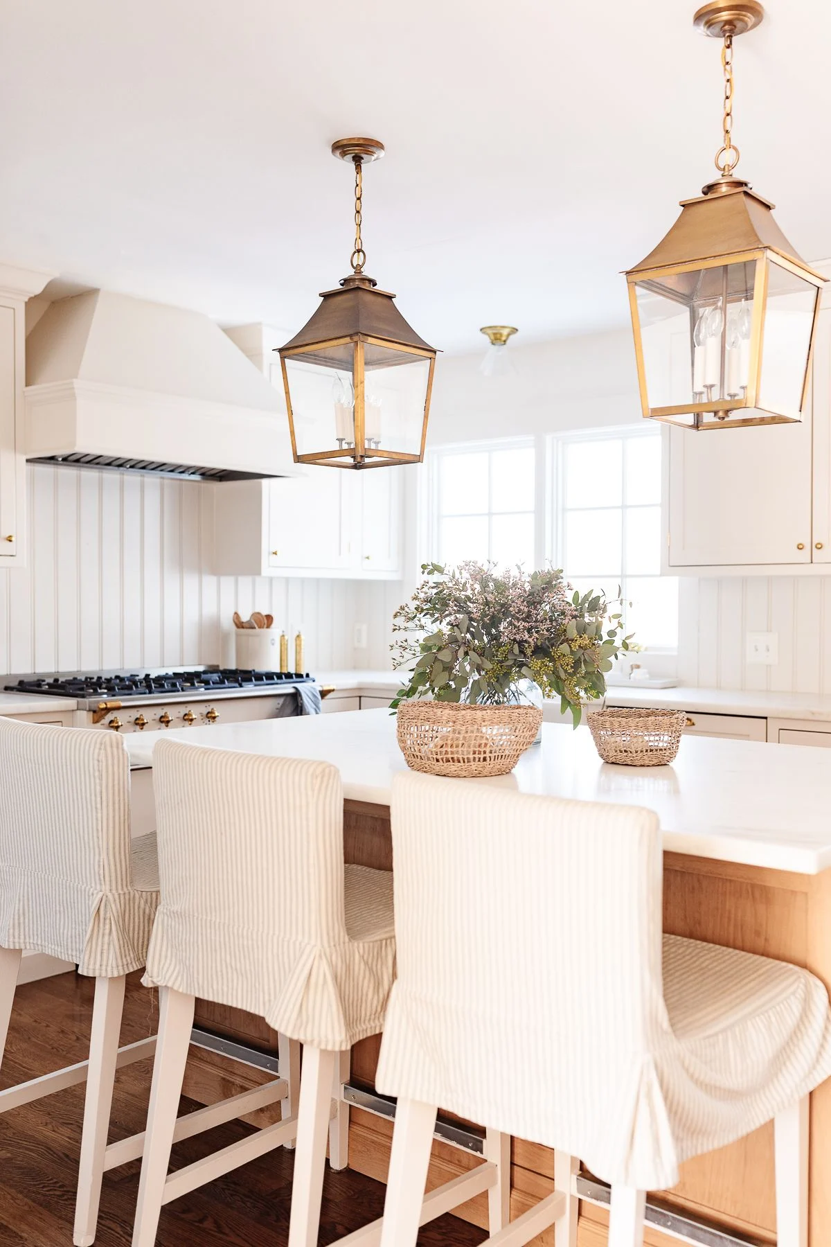 Stylish bar stools adding a touch of elegance to the kitchen island.