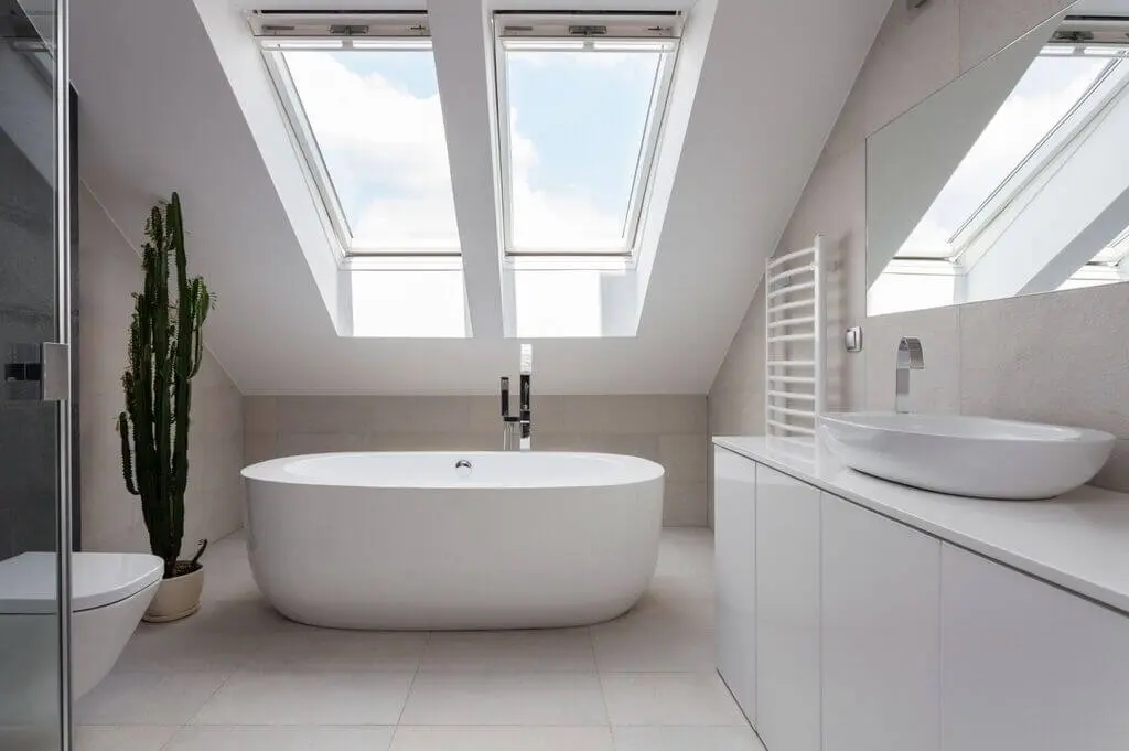A luxurious bathroom bathed in natural light, enhancing the elegance of the space.