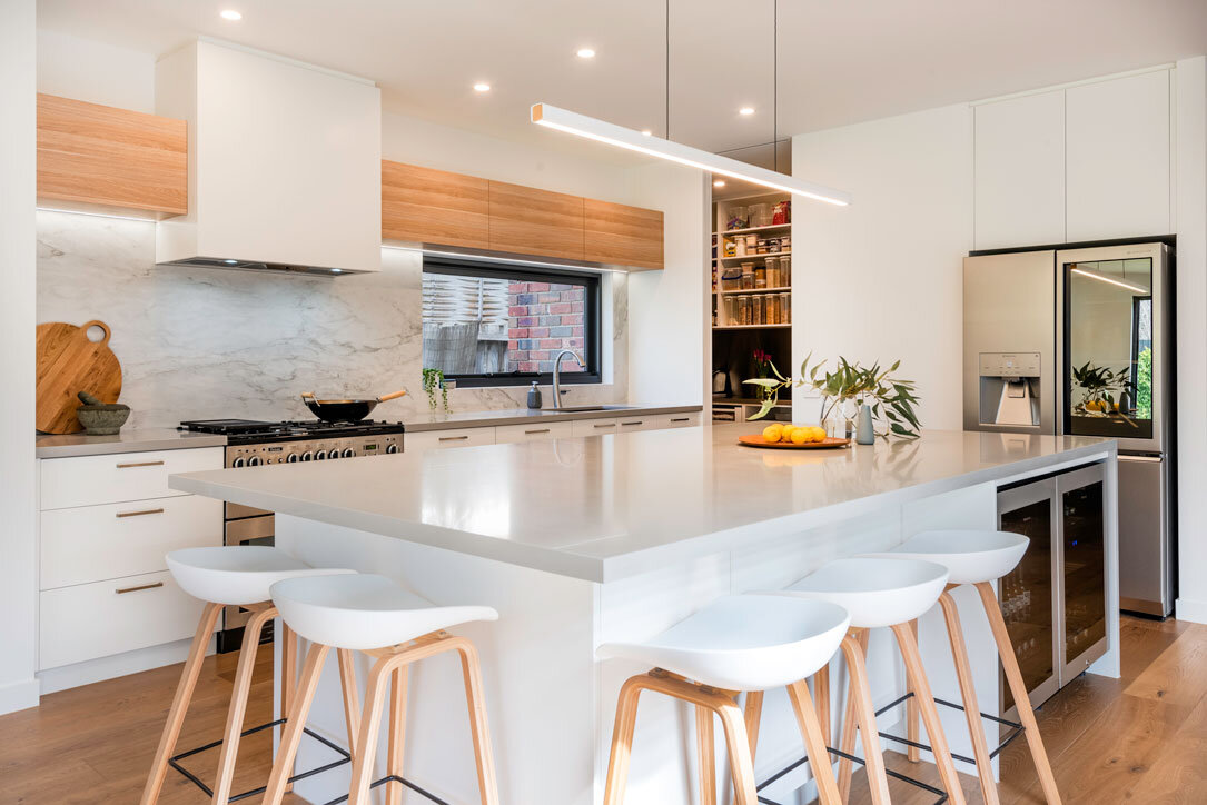 The Entertainer's Dream: Combining luxury and sociability with a built-in wine cooler and seating.