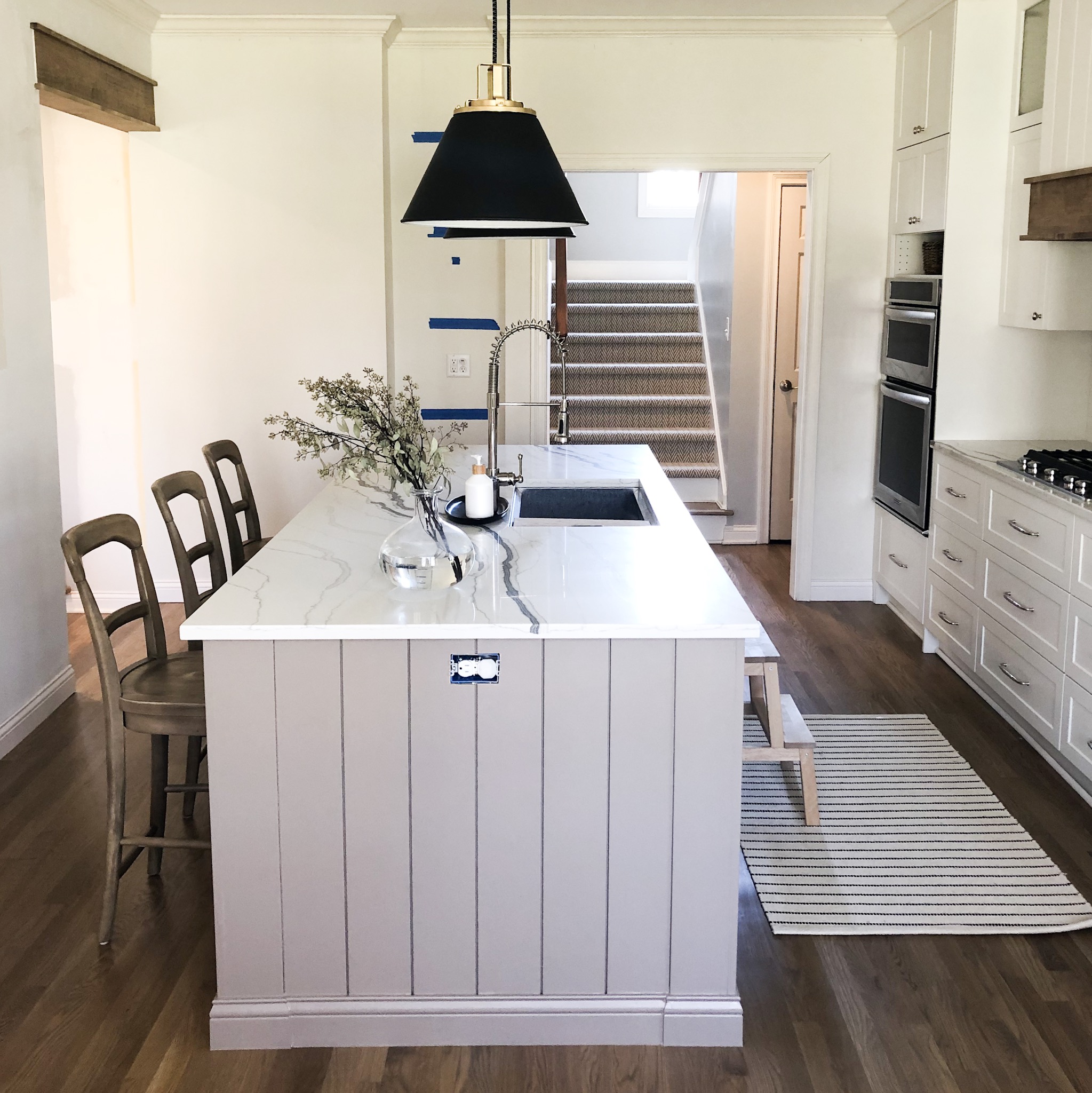 Sleek cabinetry and sophisticated finishes, integral to bespoke kitchen remodeling for a personalized touch.