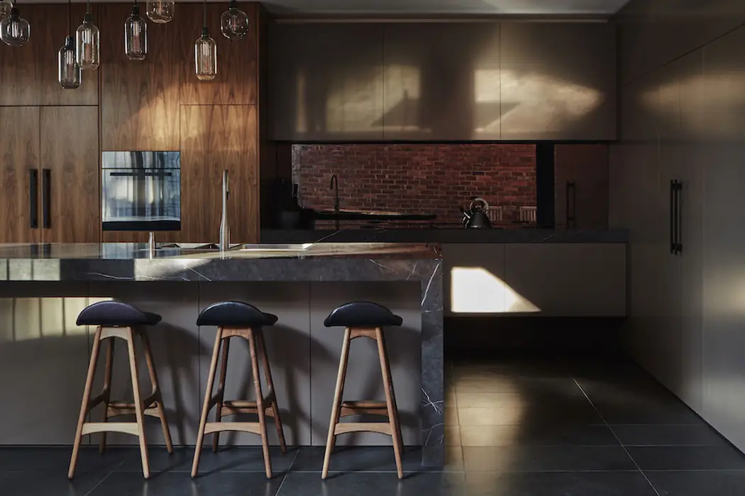 See how the kitchen becomes the focal point in modern open concept designs, blending culinary and social spaces into a dynamic hub.