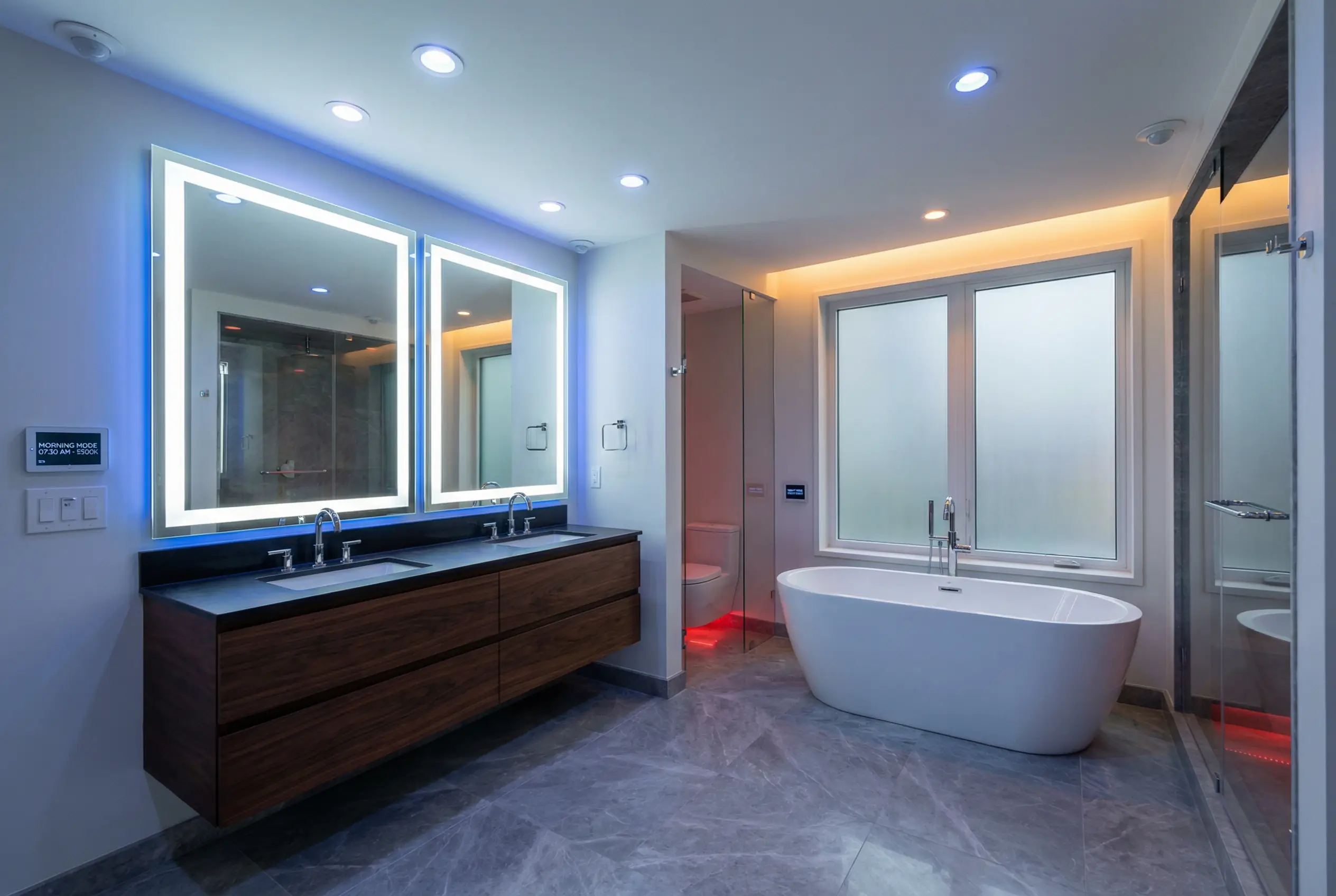 NYC luxury bathroom with smart circadian lighting featuring adjustable color temperature for morning energizing and evening relaxation modes