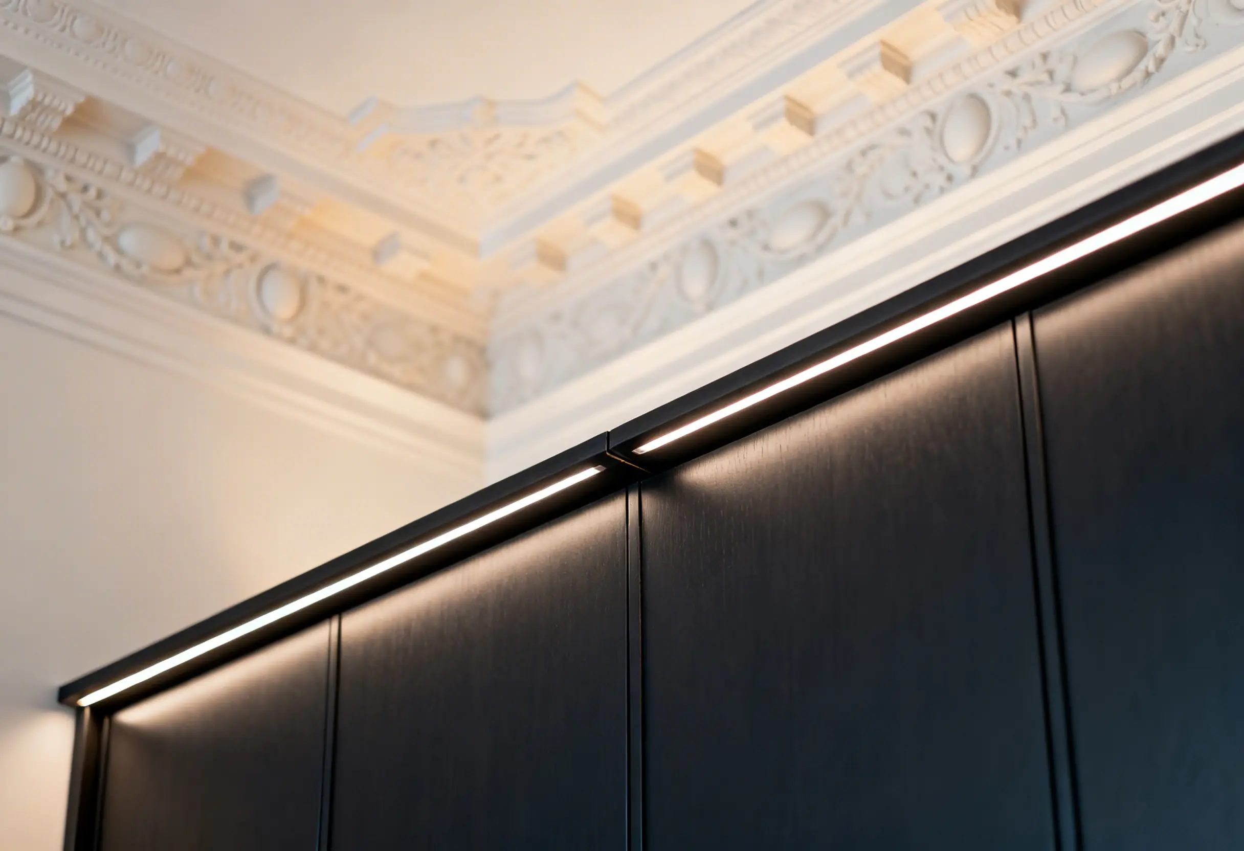 Custom closet panel scribed to pre-war crown molding in Manhattan apartment showing precision millwork detail